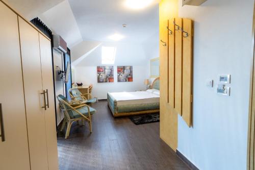 Tempat tidur dalam kamar di Olympic Apartments Wellness & Spa