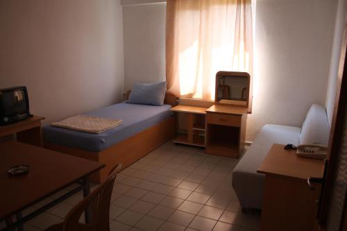 Un ou plusieurs lits dans un hébergement de l'établissement Orçin Apart Hotel