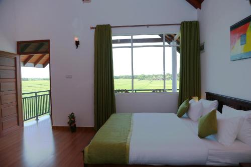 Postel nebo postele na pokoji v ubytování Avonil Resort Yala
