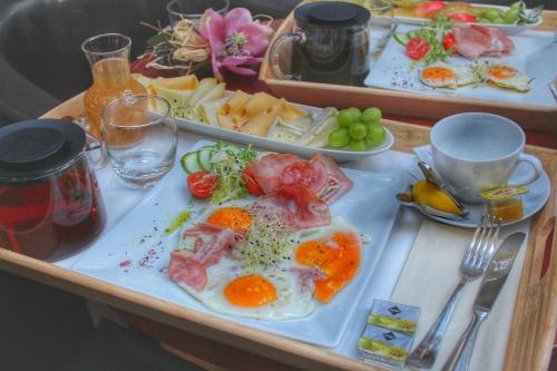 a tray with a variety of foods on it at Hotel Telč in Telč
