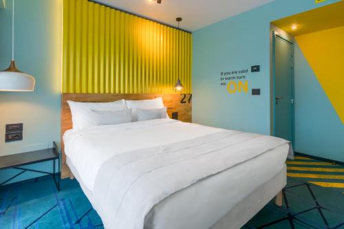 Cama o camas de una habitación en ibis Styles Bucharest Erbas