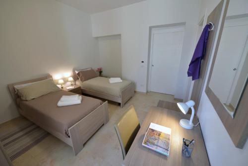 Postel nebo postele na pokoji v ubytování B&B dei Ciclopi