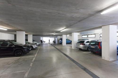 a parking garage with cars parked in it at Hotel Villa Isabella in Brenzone sul Garda