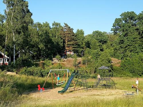 a group of children playing on a playground at Svalemåla Stugby in Bräkne-Hoby