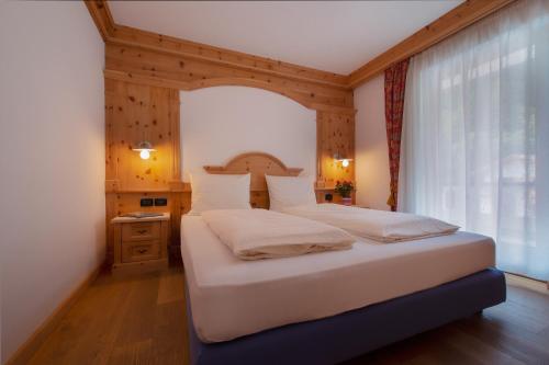 Una cama o camas en una habitación de Residence Barbara