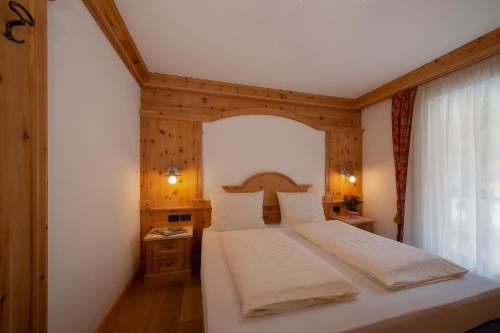Una cama o camas en una habitación de Residence Barbara