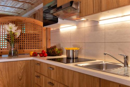 a kitchen with a sink and a counter top at Residence Barbara in Colfosco