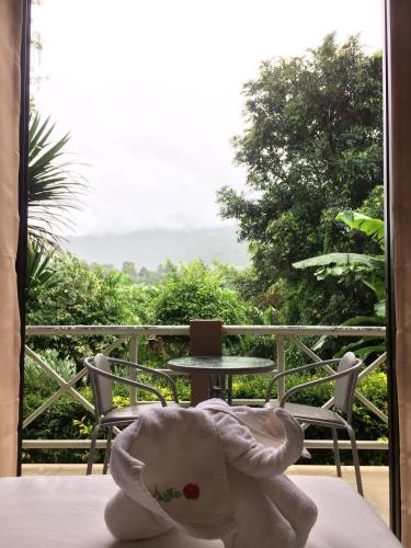 a towel is sitting on a table on a balcony at Phurua Bussaba Resort & Spa in Loei