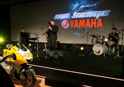 a group of people on a stage with a motorcycle at TH Lazise - Hotel Parchi Del Garda in Lazise