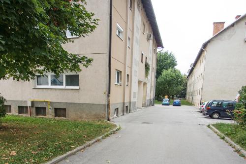 an empty street next to a building at Goldenfields apartment in Kranj