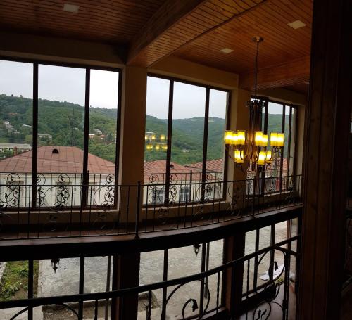 a balcony with windows and a view of a building at Philia's Guest House in Sighnaghi