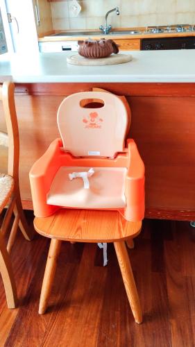a toaster sitting on a chair in a kitchen at L'Atelier du Temps - PanoramAlps Apartment in Courmayeur