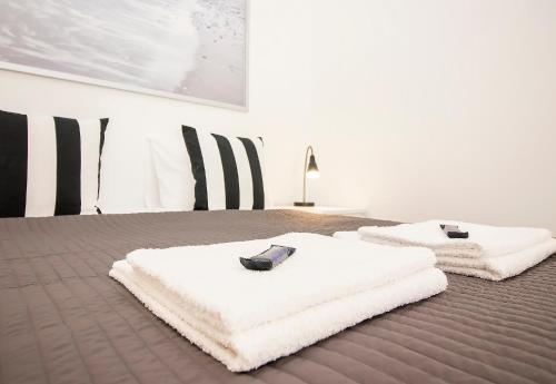 Ένα ή περισσότερα κρεβάτια σε δωμάτιο στο Guest Apartment Tuuttikuja