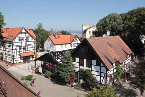 an overhead view of a town with white and black buildings at Fisherman's House in Ustka