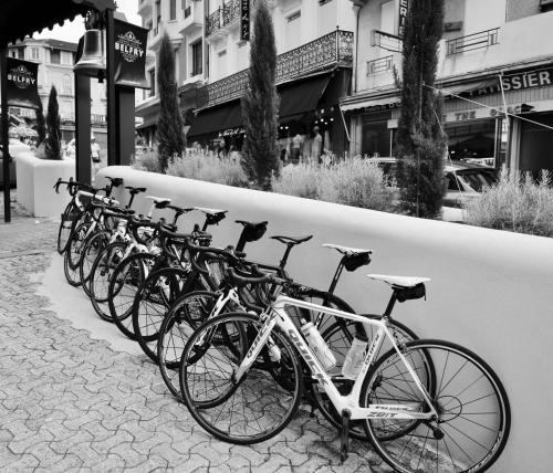a row of bikes parked next to a wall at Belfry & Spa by Ligne St Barth in Lourdes