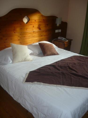 Ένα ή περισσότερα κρεβάτια σε δωμάτιο στο Hotel Chamois d'Or