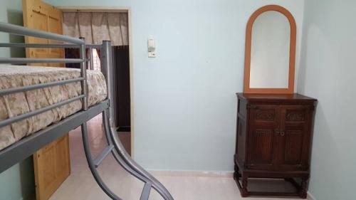 Postel nebo postele na pokoji v ubytování Homestay De MITC Melaka