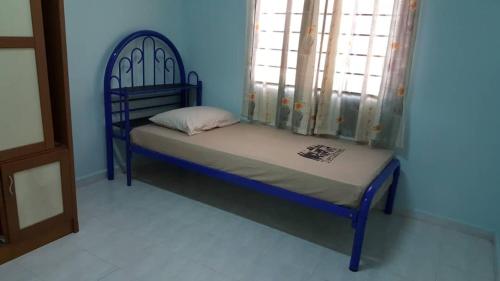 Katil atau katil-katil dalam bilik di Homestay De MITC Melaka