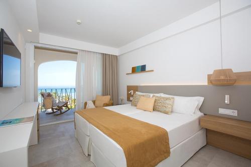 a hotel room with a bed and a balcony at Myseahouse Flamingo - Adults Only 4* Sup in Playa de Palma
