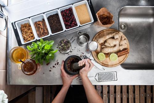 a person is preparing food on a kitchen counter at Hostinec u Hromadov - ubytovanie v súkromí in Rajecká Lesná