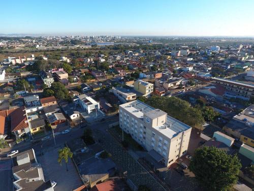 an aerial view of a city with buildings at Hotel Ville House Premium in Canoas