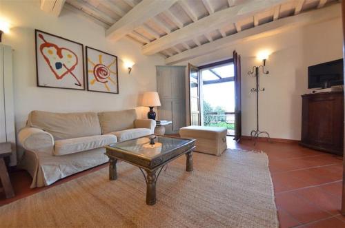 a living room with a couch and a coffee table at Mela a Poderone in Roccalbegna