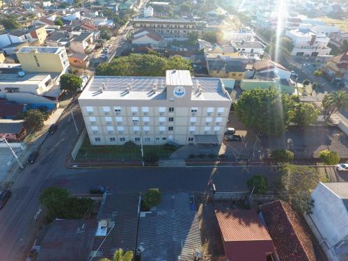 an overhead view of a city with a building at Hotel Ville House Premium in Canoas