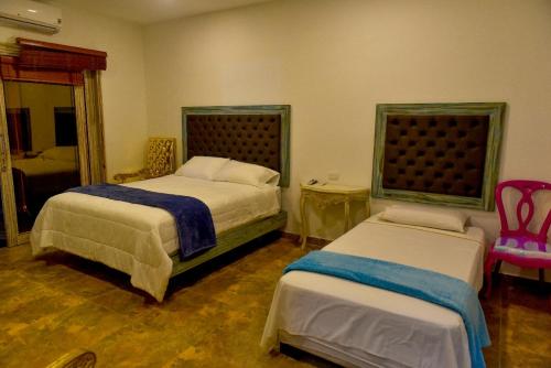 Uma cama ou camas num quarto em Hotel Finca Naranjal