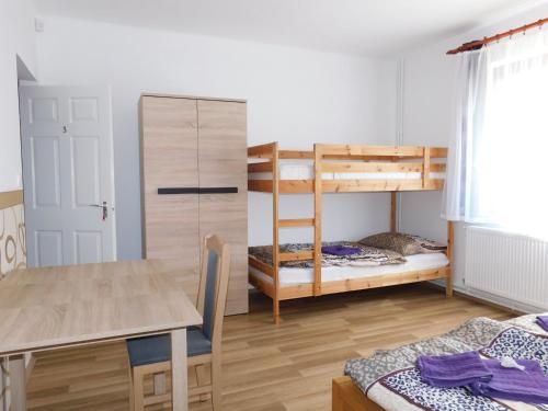 Кровать или кровати в номере 8888 Vendégház
