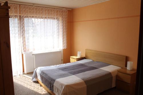 Cama o camas de una habitación en Ferienwohnung Hofmann