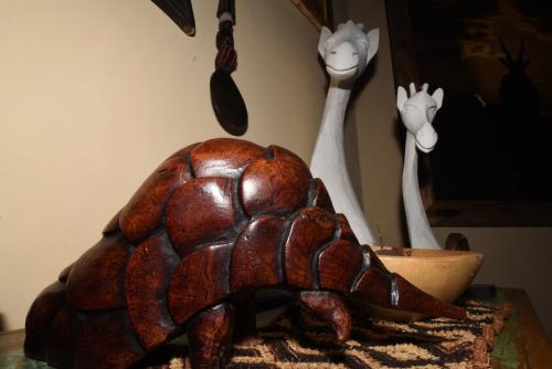 a wooden turtle sitting on top of a table at Cheetah Holiday Club in Vizovice