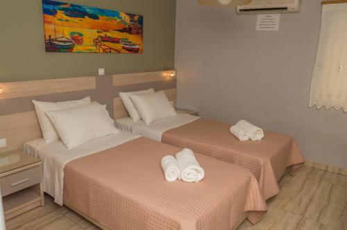 Кровать или кровати в номере Dionos Villa
