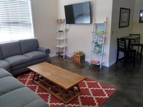 a living room with a couch and a coffee table at Swantown Inn in Olympia