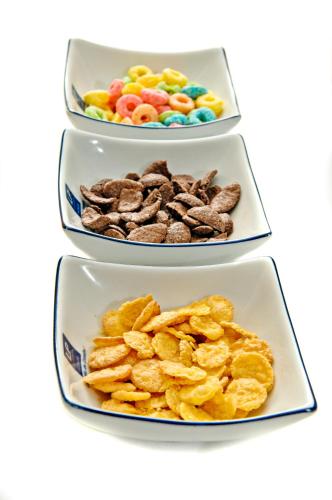 a trio of three bowls filled with different types of food at Hotel LP Columbus in La Paz