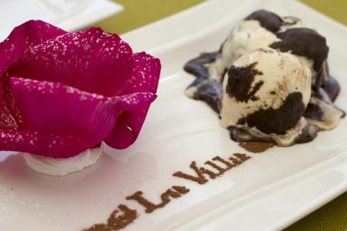 a plate of ice cream with a flower on it at Park Hotel in Karagandy