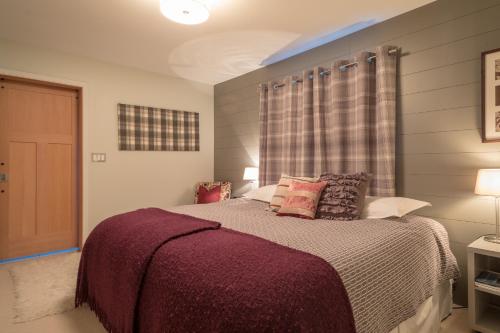 Säng eller sängar i ett rum på Home Lodge