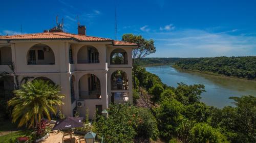 a building with a view of a river at Casa Blanca in Ciudad del Este