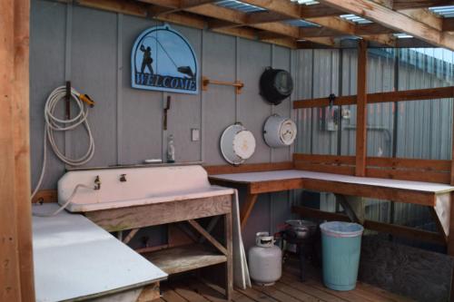 a bathroom with a sink and a welcome sign on the wall at Mermaid Inn in Long Beach