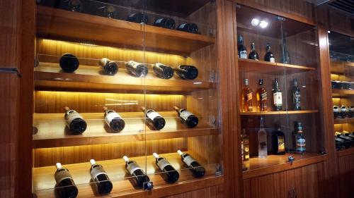 a wine cellar with shelves of wine bottles at Hotel Landmark Canton in Guangzhou