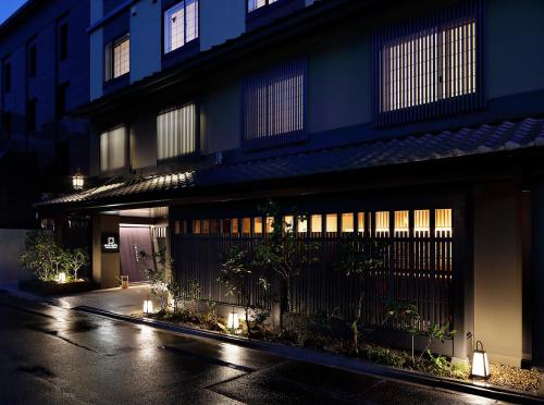 a building at night with lights in front of it at Hotel Resol Kyoto Shijo Muromachi in Kyoto