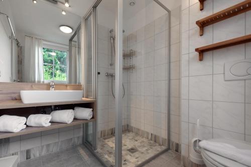 a bathroom with a sink and a shower at Ferienanlage Central in Flachau