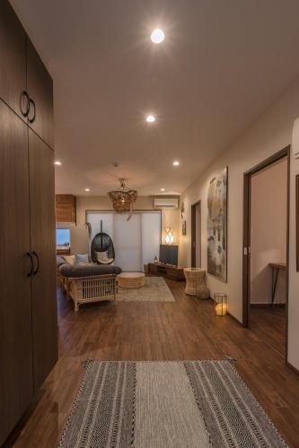 a large living room with a bed and a couch at BB Wakugawa Terrace in Nakijin