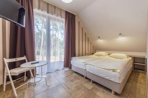 Llit o llits en una habitació de Villa Arkadia MARE