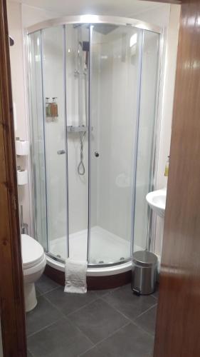 a bathroom with a shower and a toilet at Cambridge House in Edinburgh
