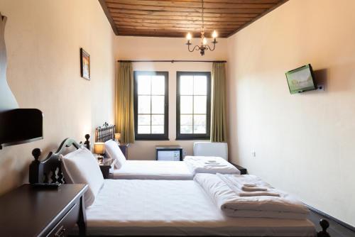 Ένα ή περισσότερα κρεβάτια σε δωμάτιο στο HiStory INN Unique Guest House