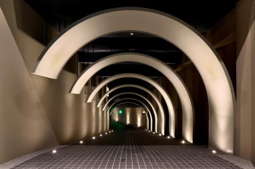 a tunnel with lights on the side of a building at KUN Hotel in Taichung