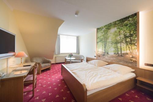 Кровать или кровати в номере Hotel Röhrs