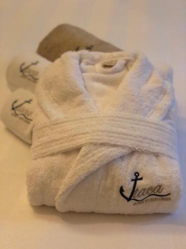 a white towel with an anchor written on it at Itaca Home to Explorers in Polignano a mare in Polignano a Mare