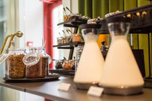 two bottles of milk sitting on top of a counter at Park Hotel Viljandi in Viljandi
