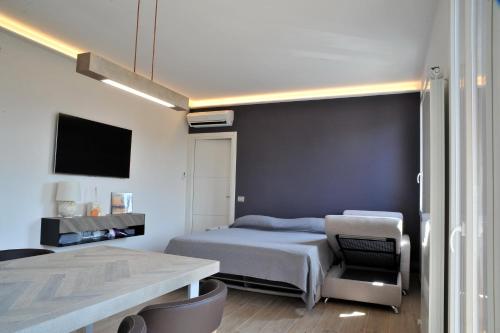 Un pat sau paturi într-o cameră la Green Garda Desenzano